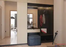 Hallway interior with shoe rack and mirror
