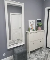 Hallway interior with shoe rack and mirror