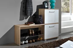 Hallway interior with shoe rack and mirror