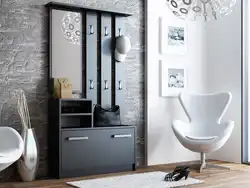 Hallway interior with shoe rack and mirror