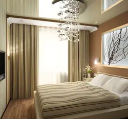 Interior of a small bedroom with a balcony