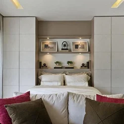 Bedroom design with two wardrobes next to the bed