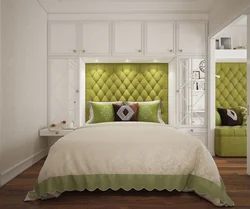 Bedroom design with two wardrobes next to the bed