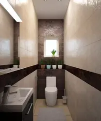 Interior of a small toilet in an apartment separate from the bathtub in a panel