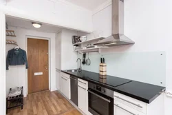 Photo of a kitchen in the hallway in a one-room apartment