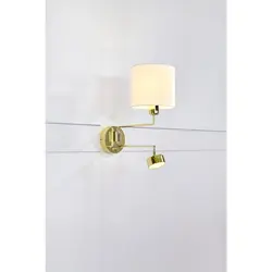 Sconce on the wall in the bedroom above the bed photo