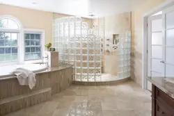 Bathtub with glass block partition photo