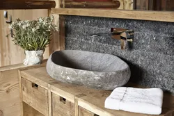Stone sink in the bathroom interior