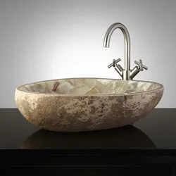 Stone sink in the bathroom interior