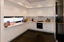 Glossy corner kitchen in the interior