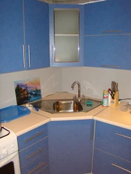 Small corner kitchen design with sink in the corner