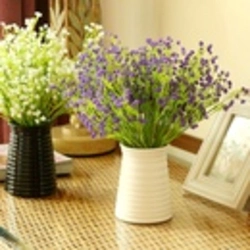 Artificial Flowers In Pots In The Kitchen Interior