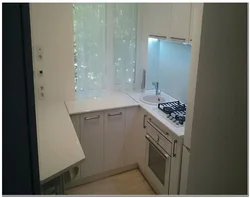 Khrushchev kitchen design with a niche under the window