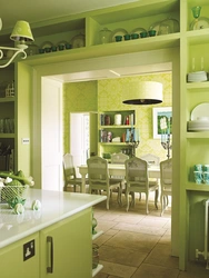 Combination of green color in the interior of the kitchen and living room
