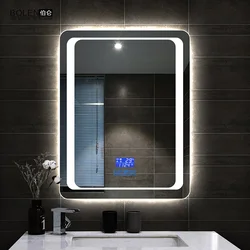 Bathtub with illuminated mirror photo