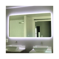 Bathtub with illuminated mirror photo