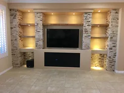 Plasterboard niche for TV in the living room photo