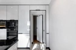 If the entrance door is in the kitchen photo