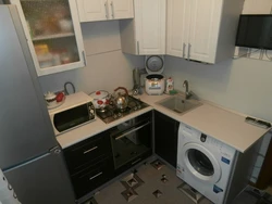 Design of a small kitchen in Khrushchev with a refrigerator and washing machine