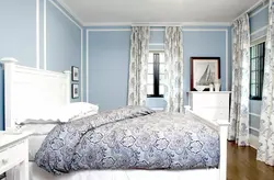 Curtains in the bedroom interior with blue wallpaper