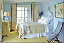 Curtains in the bedroom interior with blue wallpaper