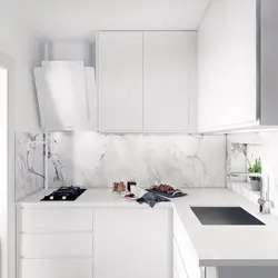 Kitchen design with marble countertops and splashback