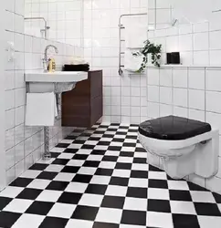 White Bathtub With Black Floor Photo