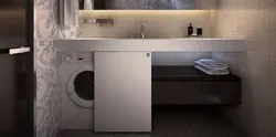 Жуынатын бөлмедегі фотосуретте кір жуғыш машинаны жасырыңыз