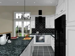 Kitchen with a black apron and countertop in a white interior
