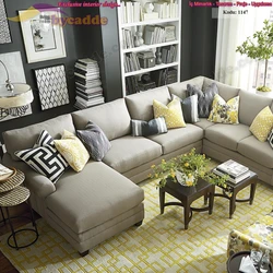 Gray sofa with pillows in the living room interior