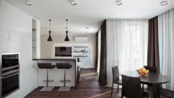 Living room kitchen with bar counter and sofa photo