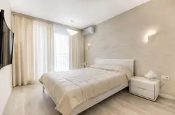 Interior of a small beige bedroom