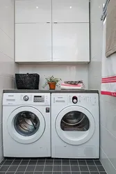 Dryer on washing machine in bathroom photo