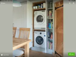 Dryer on washing machine in bathroom photo