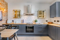 Gray kitchen design with wooden countertops