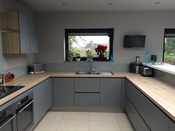 Gray kitchen design with wooden countertops