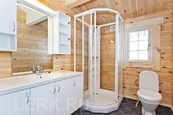 Bathrooms in a wooden house design photo with shower