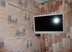 TV hanging in the kitchen photo