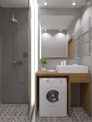 Lavabo və paltaryuyan maşın olan kiçik bir hamamın daxili