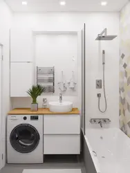 Lavabo və paltaryuyan maşın olan kiçik bir hamamın daxili