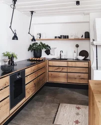 Black kitchen design without upper cabinets