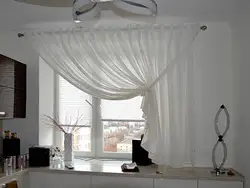 Tulle with one curtain for the kitchen photo in the interior