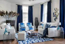 Curtains for a blue sofa in the living room interior