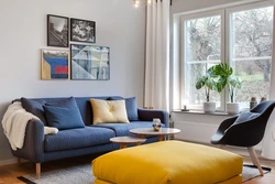 Curtains for a blue sofa in the living room interior