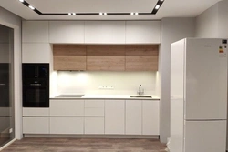 Photo of a kitchen with beige cabinets