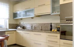Photo of a kitchen with beige cabinets