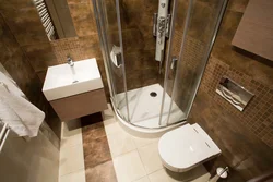 Photo of a bathtub with a shower stall