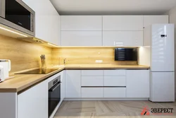 White kitchen with wooden countertop photo