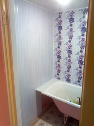 Bathtub covered with PVC panels photo