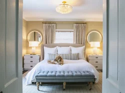 Bed by the window in the bedroom interior photo